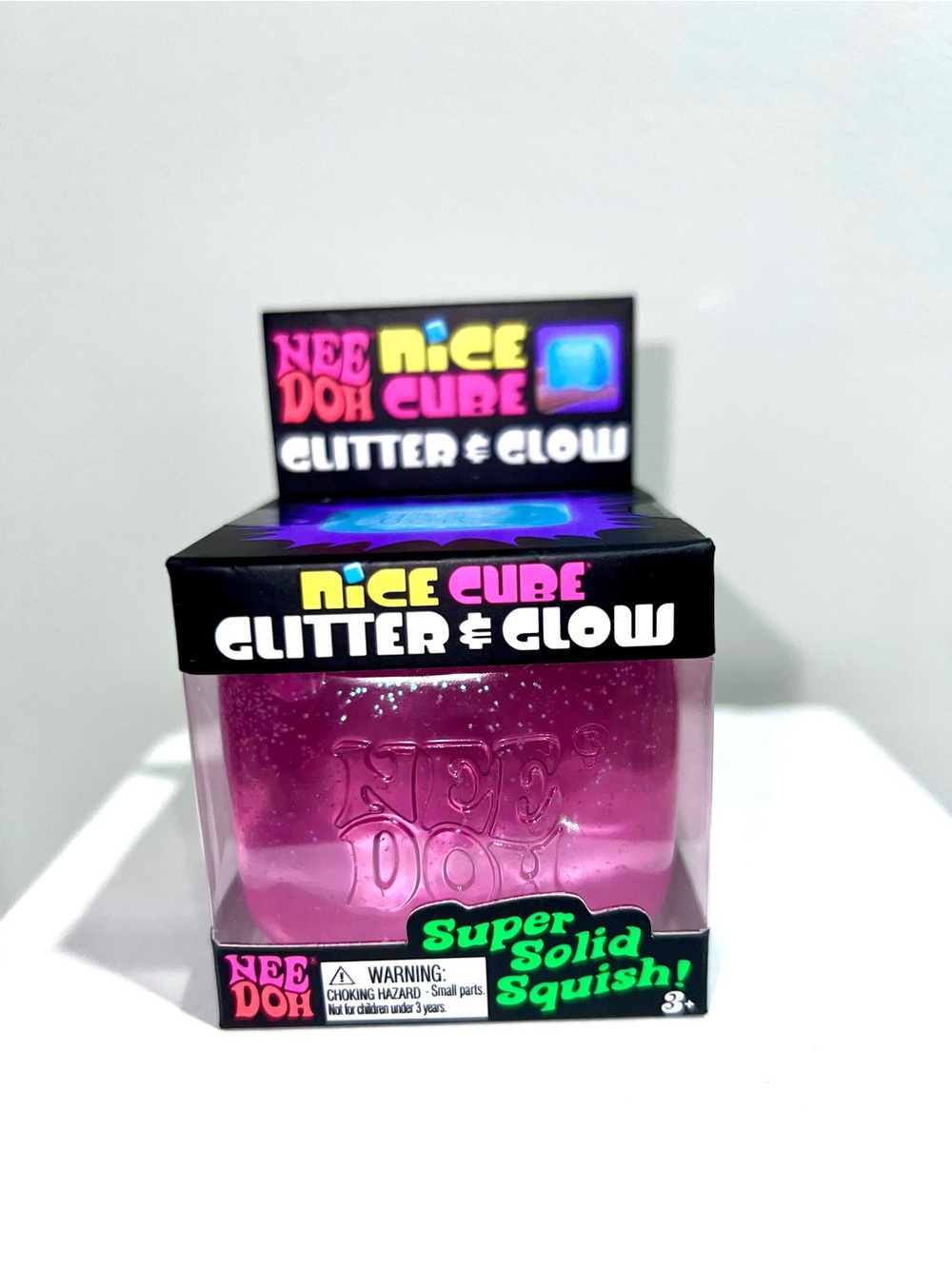 Neon pink NEEDOH Nice Cube Glitter & Glow Super Solid Squish